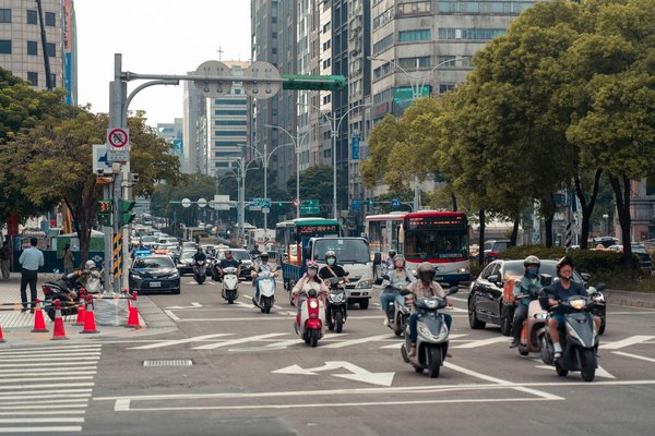 What are the regulations for carrying passengers on motorcycles in the UK?